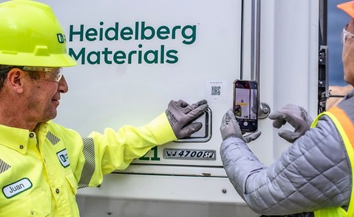 MQT 3 Man pointing to qr code and other person scanning