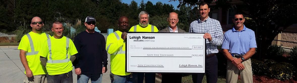 Men holding a big check