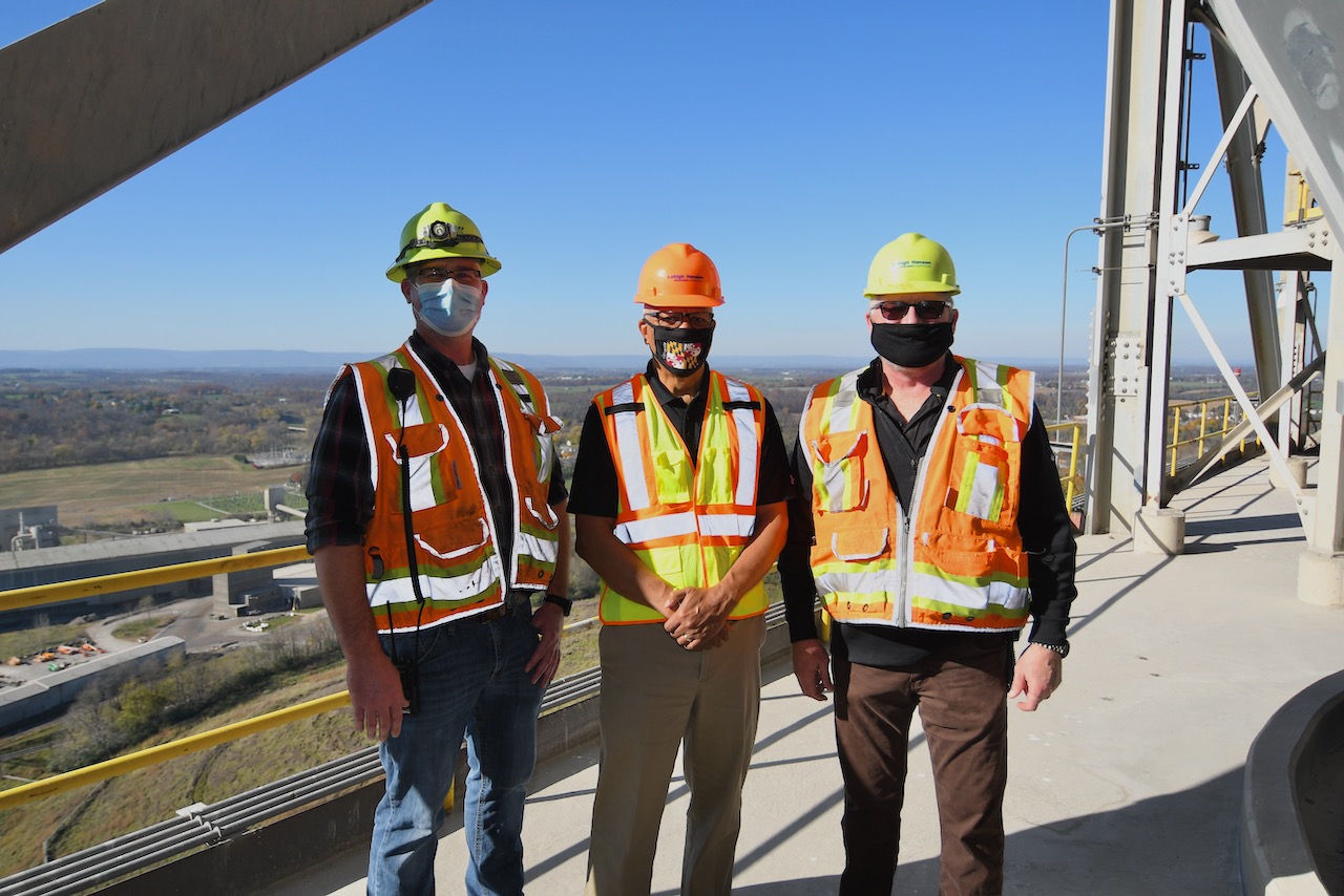 Three men standing in tower